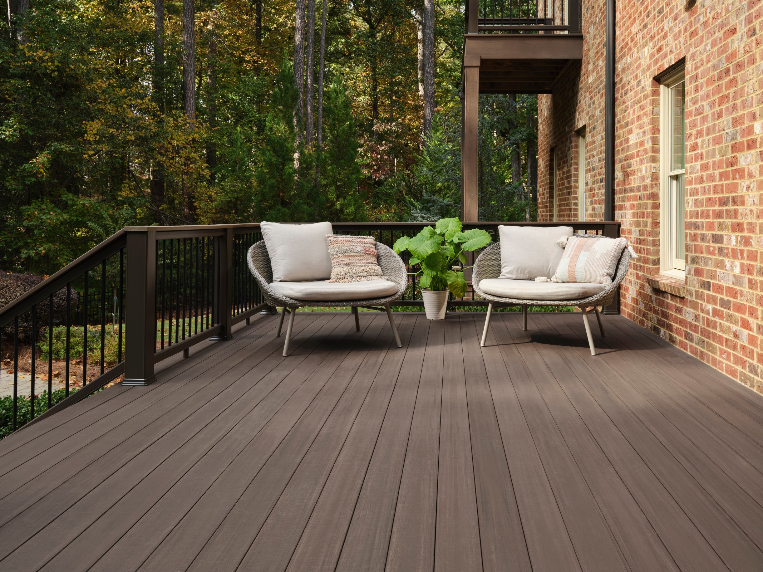 TimberTech Landmark American Walnut decking with natural dappled lighting